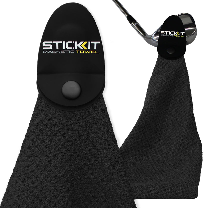 Black STICKIT magnetic golf towel attached to a golf club